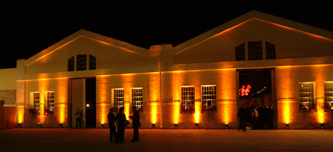 Nalaga'at at night lit from the front by lights at the base of the façade